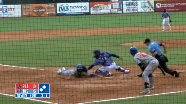 Brennen Davis throws out a runner at home