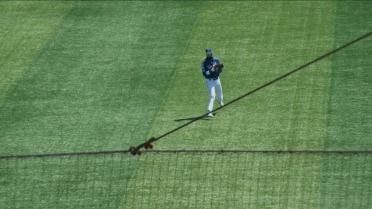 Eli Serrano III throws out a pair of runners at home