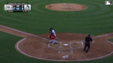 Chase DeLauter throws out a runner at home