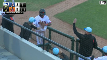 Maui Ahuna avoids a tag at home