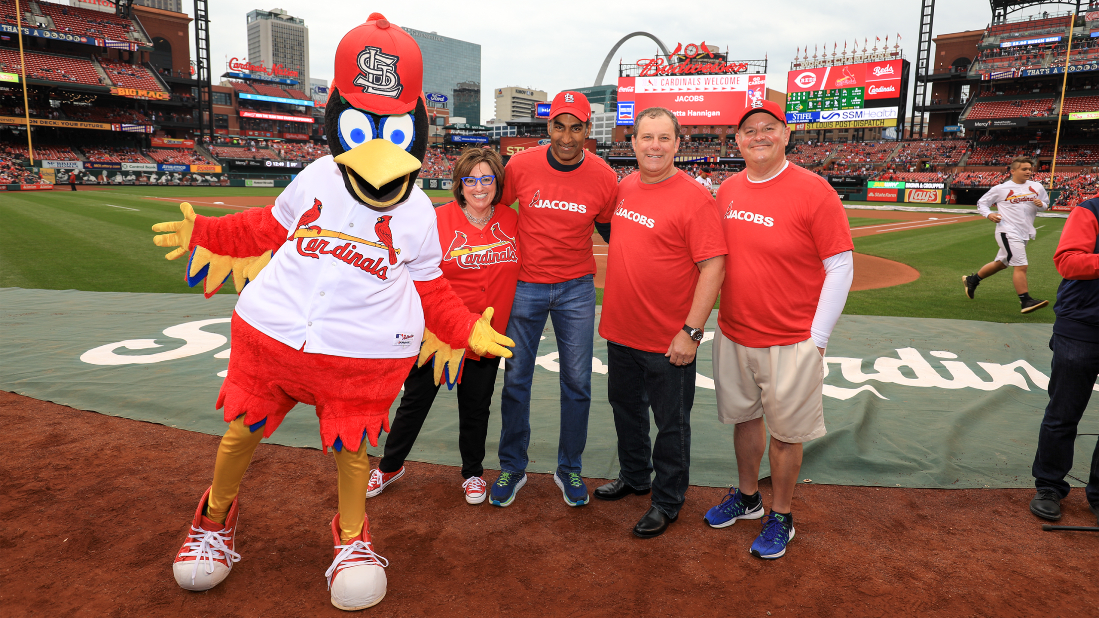 Group on field with Redbird mascot