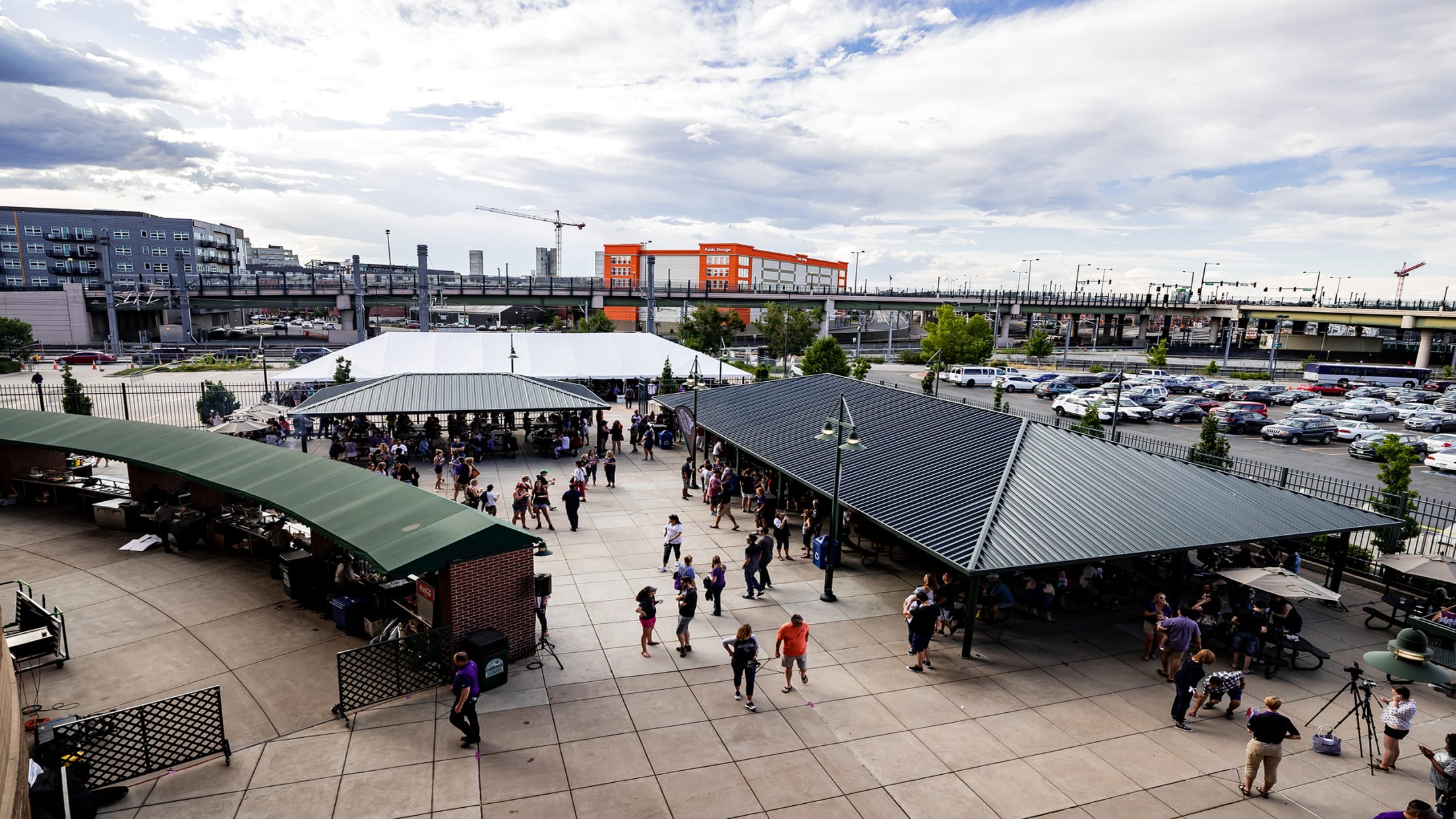 Fans enjoying a pregame picnic area at Coors Field with shelter