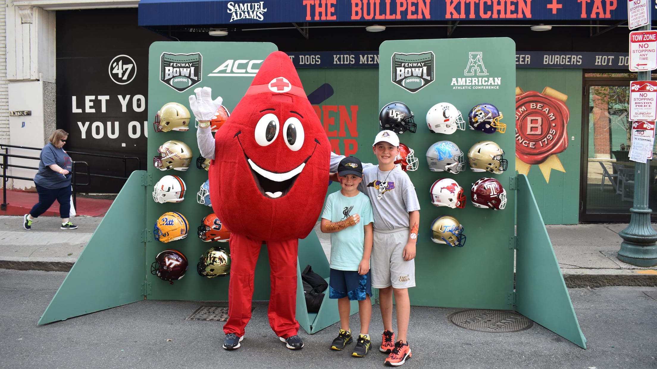 Young fans posing with mascot