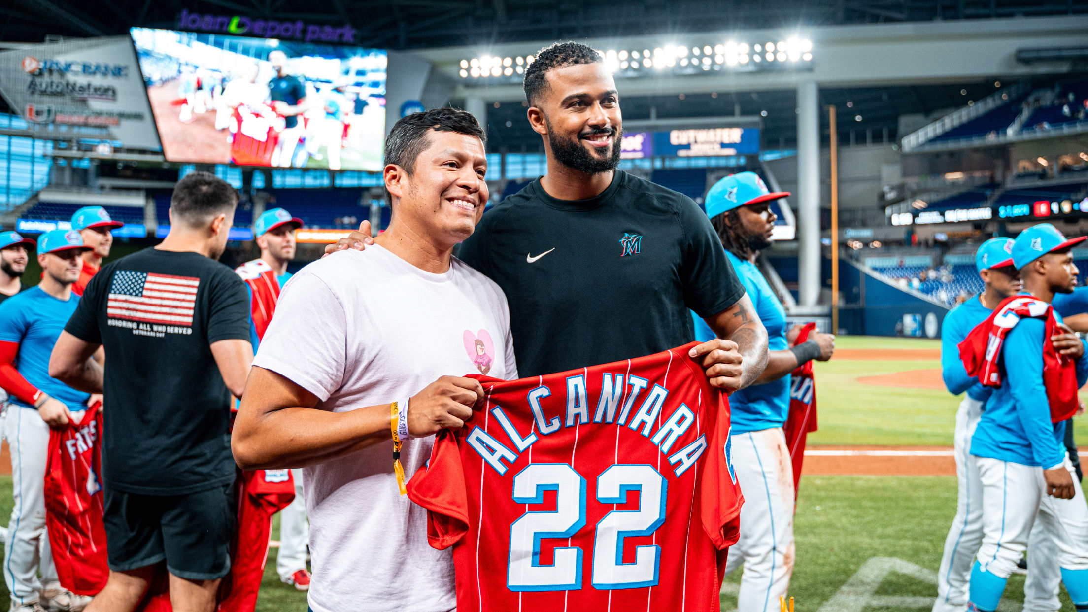 Sandy Alcantara presenting jersey to fan