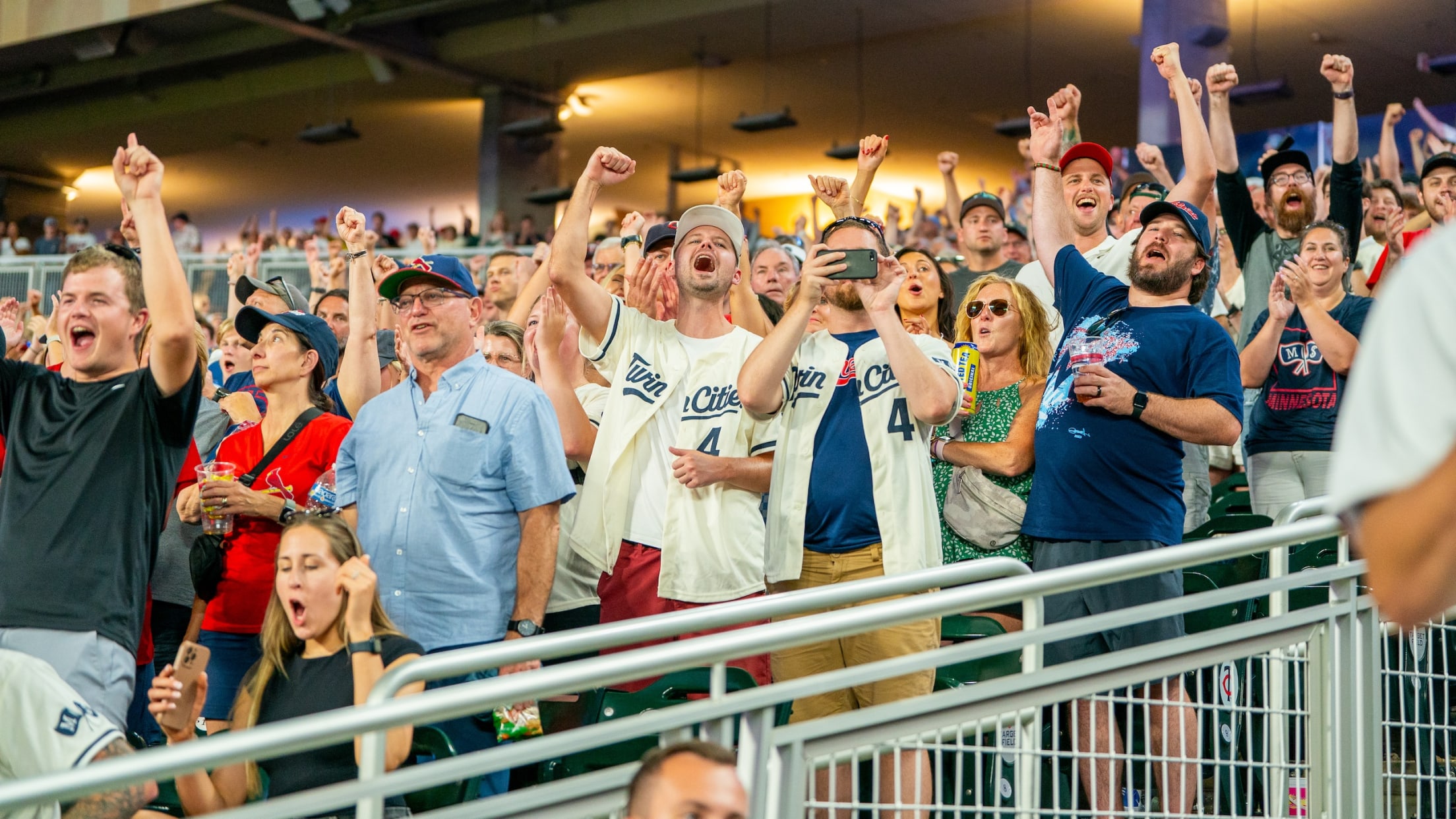 Group of Twins fans celebrating at Target Field