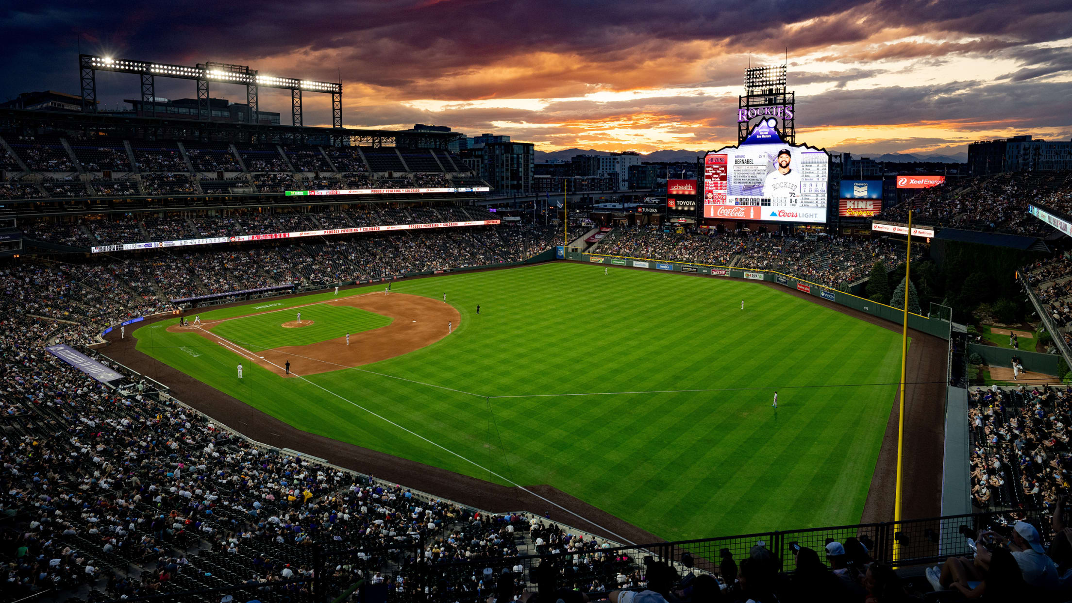 LoDo Magic at Coors Field with a full house and stunning Denver sunset during Rockies baseball