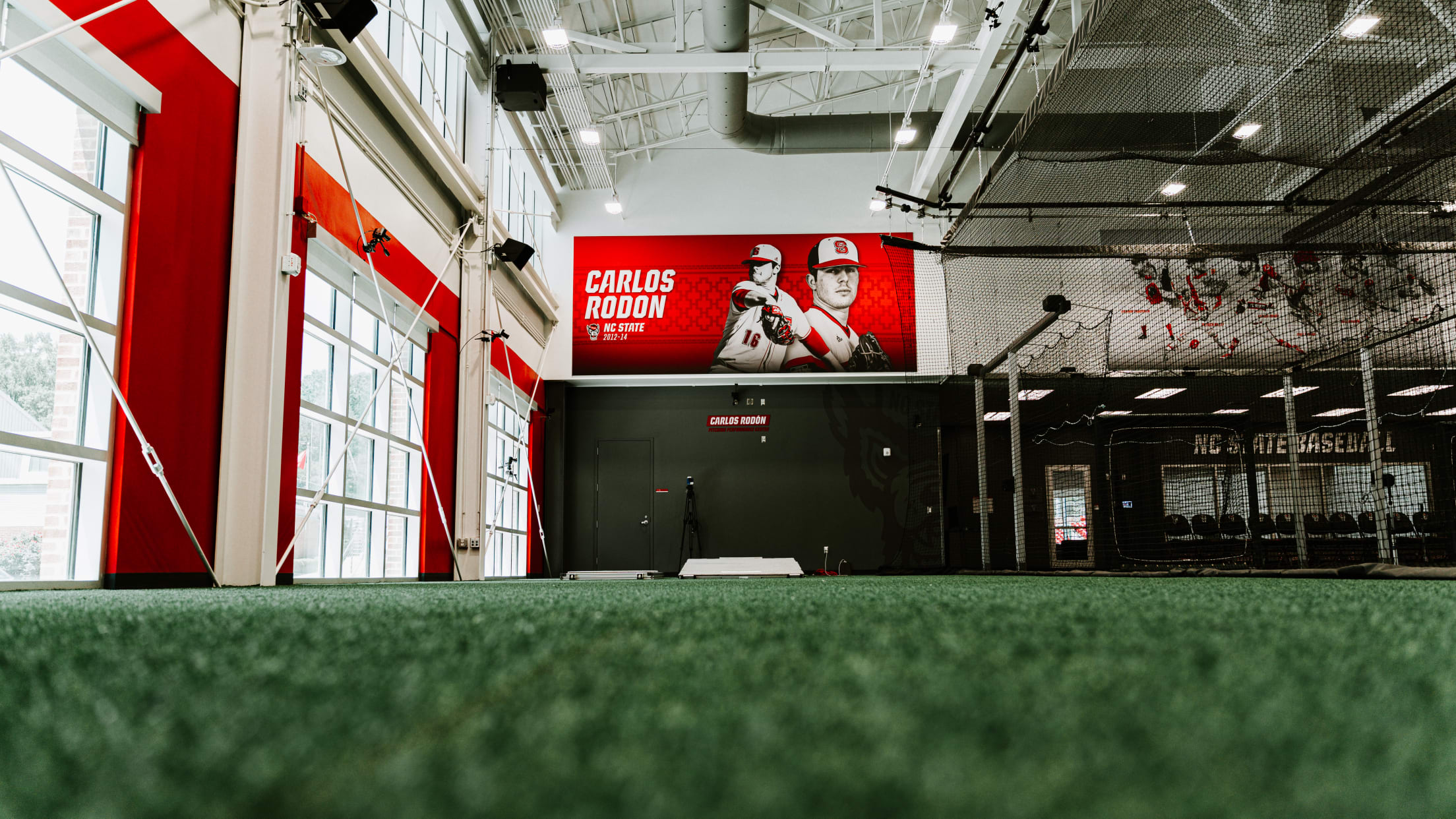 A Carlos Rodón banner hangs inside the Carlos Rodón Pitching Lab at North Carolina State University.