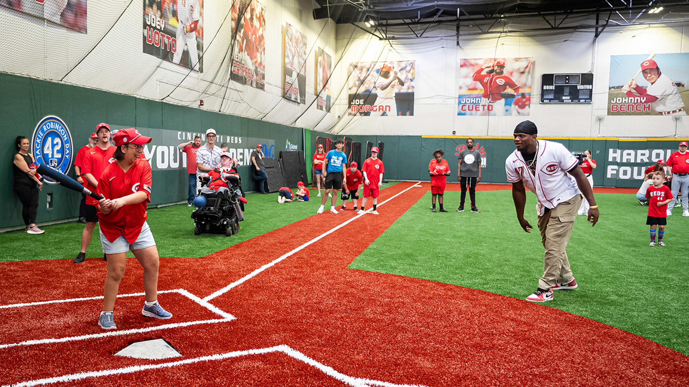 Luis Mey pitches soft toss during the camp's scrimmage.