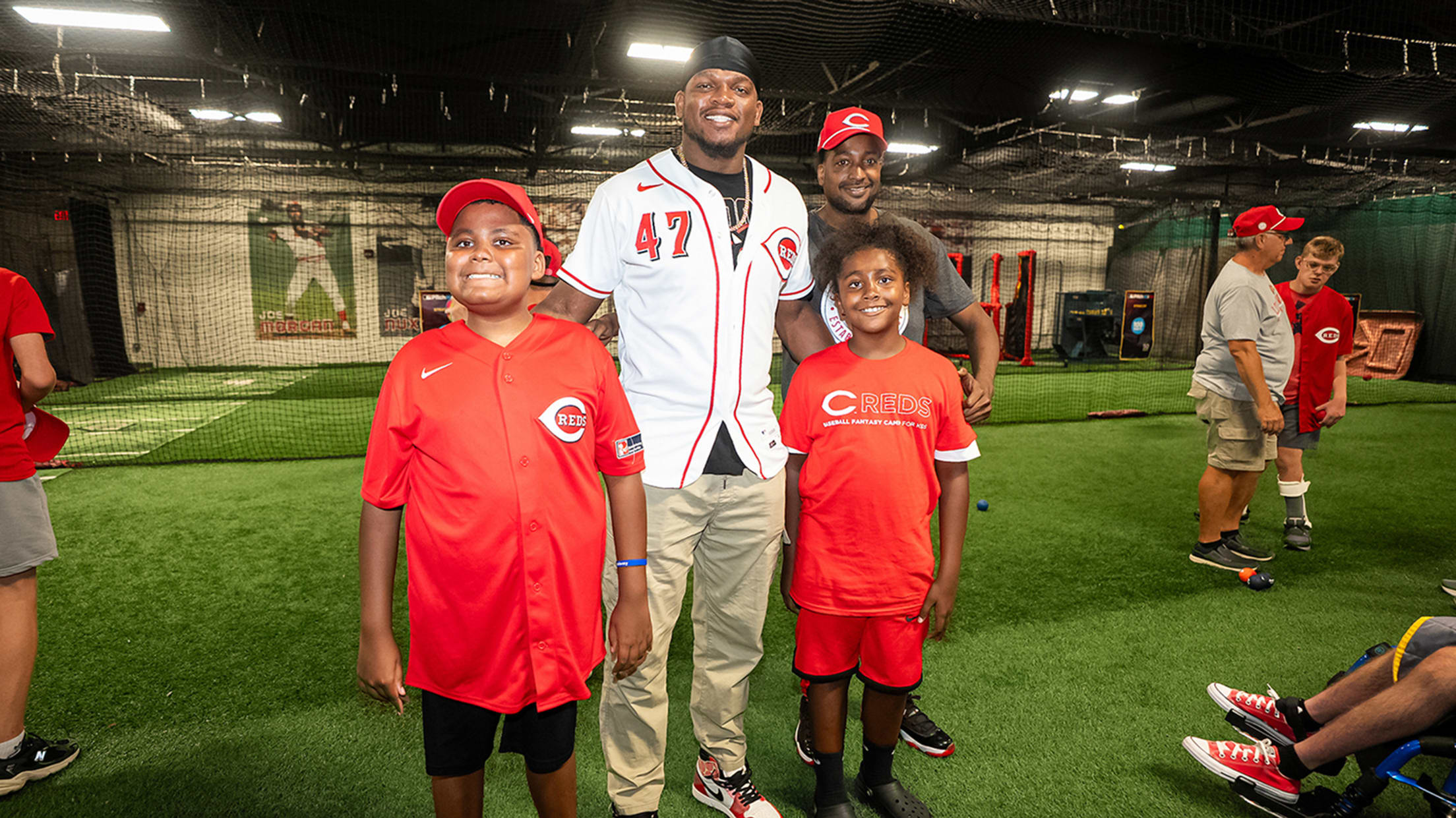 Luis Mey poses with two young participants from the clinic.