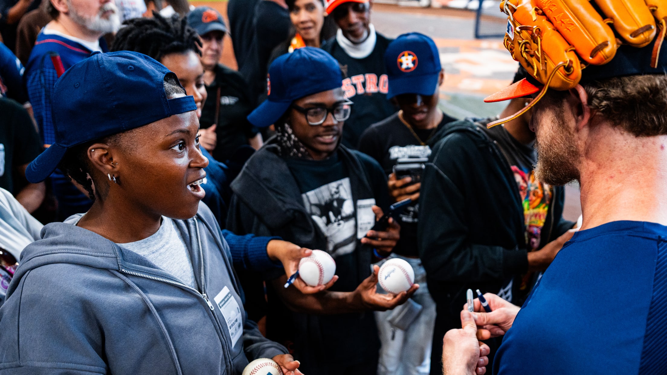 Josh Hader meets with fans during pregame practice to chat and sign baseballs.