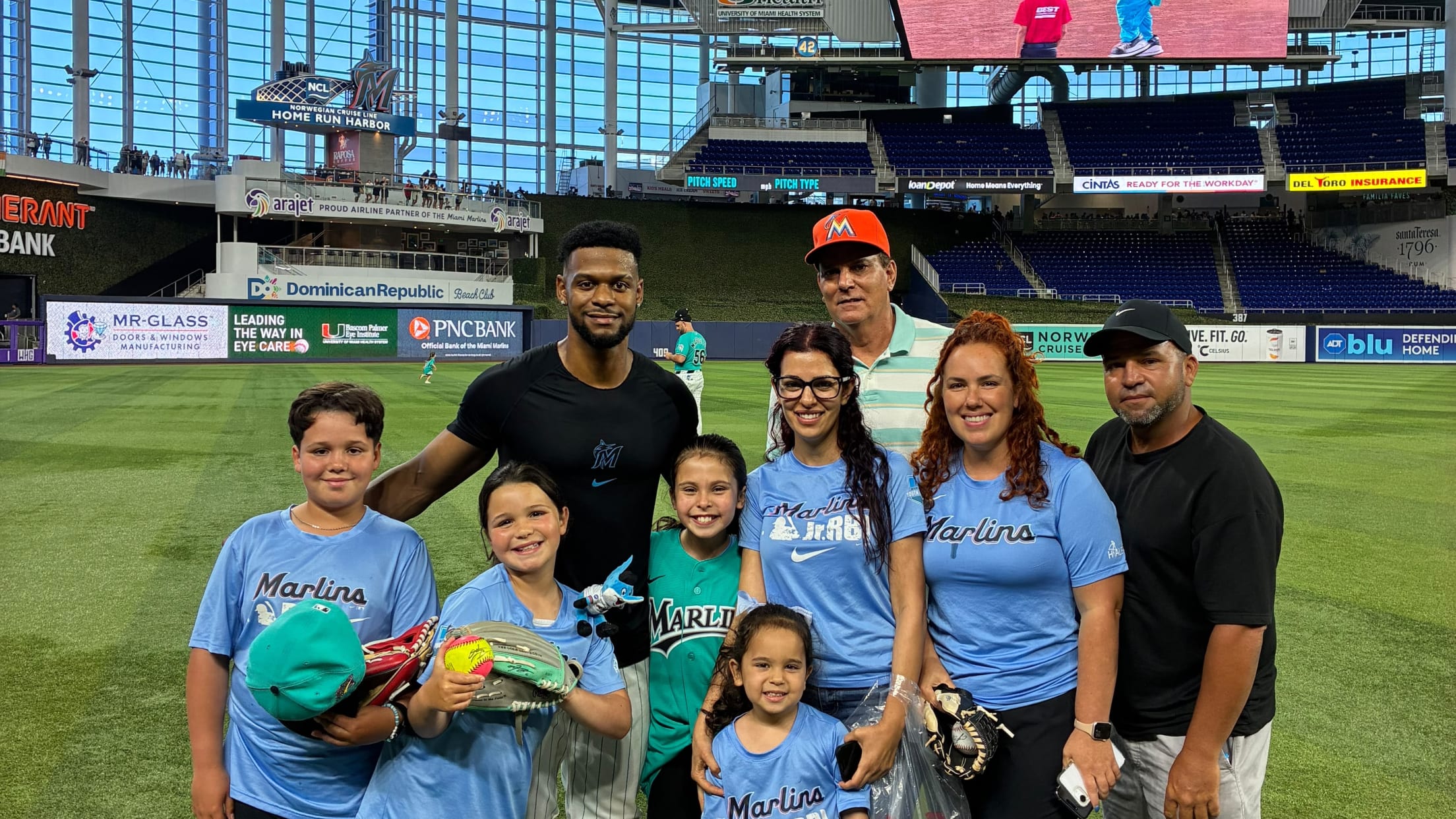 Otto Lopez takes a picture with fans apart of the Marlins Jr. RBI program.