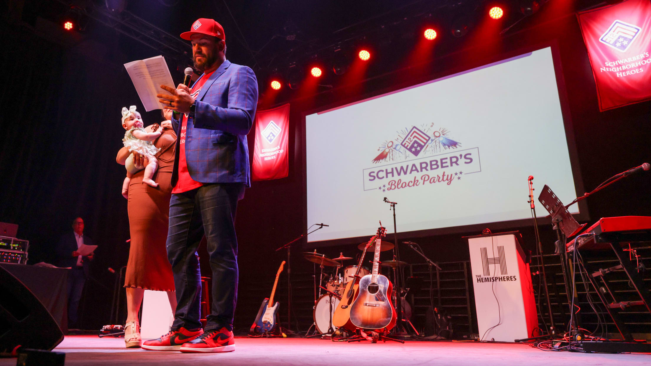 Kyle Schwarber speaks to attendees of Schwarber's Block Party.