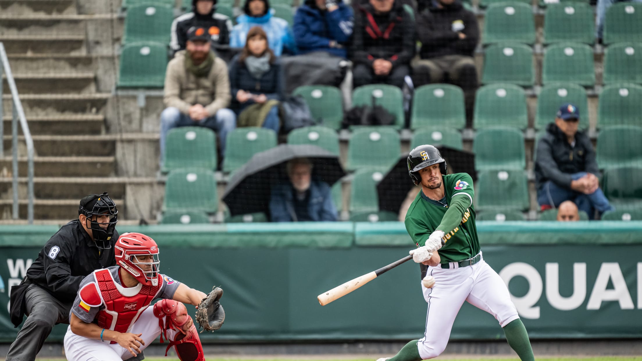 South African player Christian Beyers swings at a pitch during his team's game against Spain in the 2022 World Baseball Classic qualifiers in Regensburg.