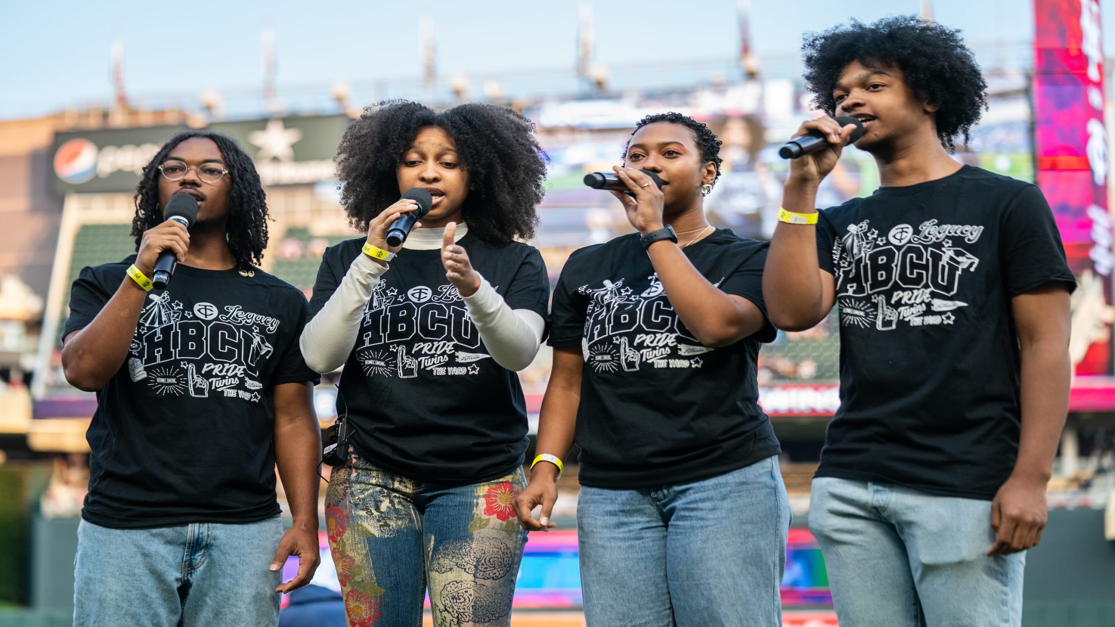 A group singing at Target Field