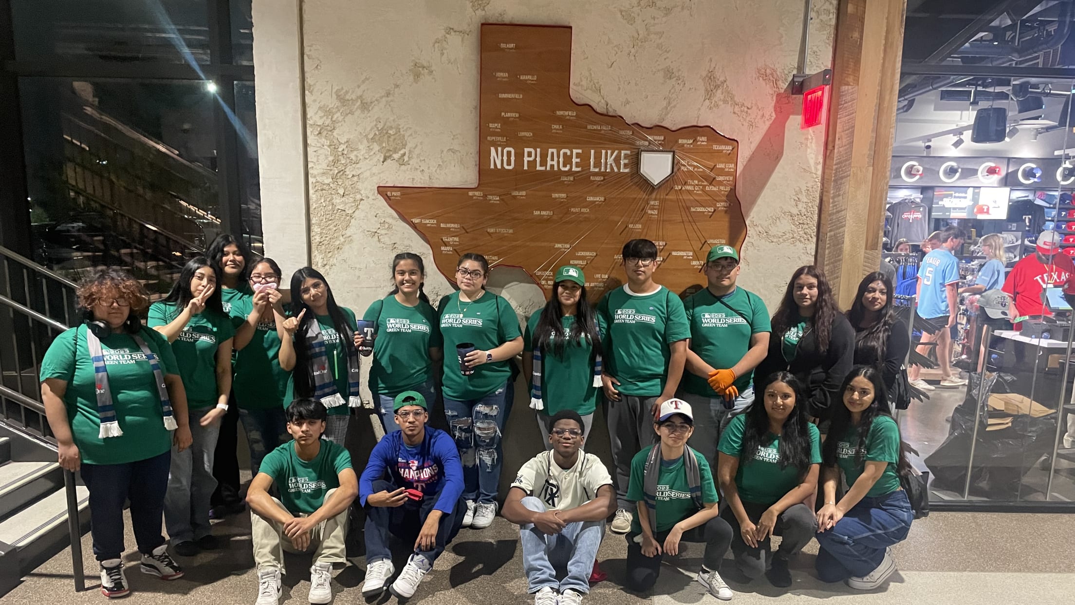 Green Team members pose for a photo during a postseason game at Globe Life Park.