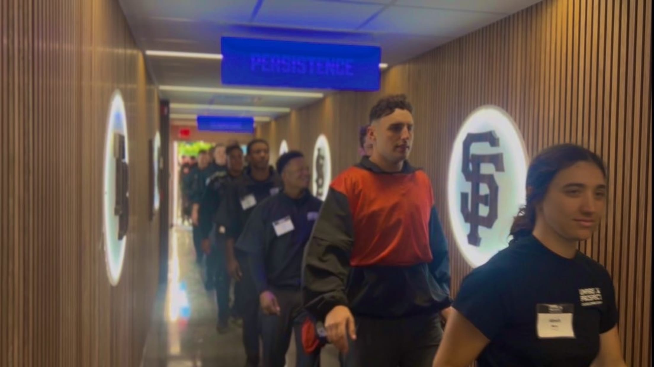 Umpire prospects walk down the hall at the Robinson Training Complex