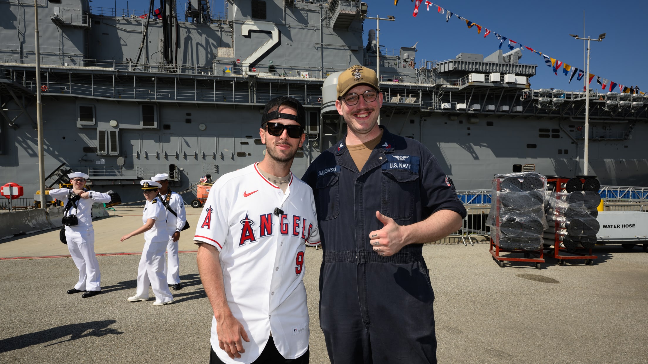 Zach Neto takes a picture with a United States service member.