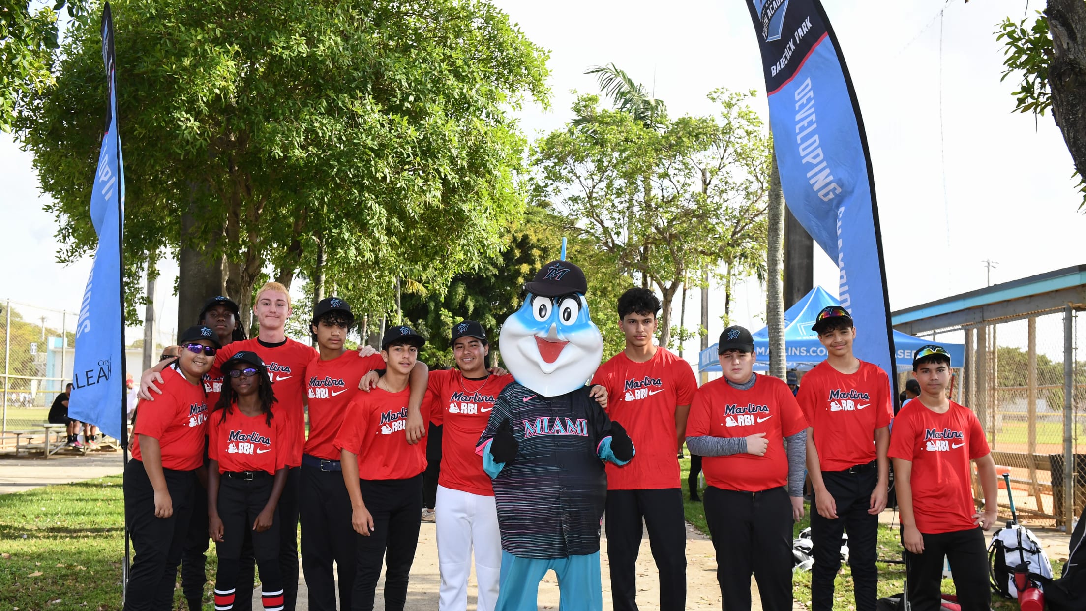 Players and Billy the Marlin take a picture to celebrate Marlins Nike RBI Opening Day.