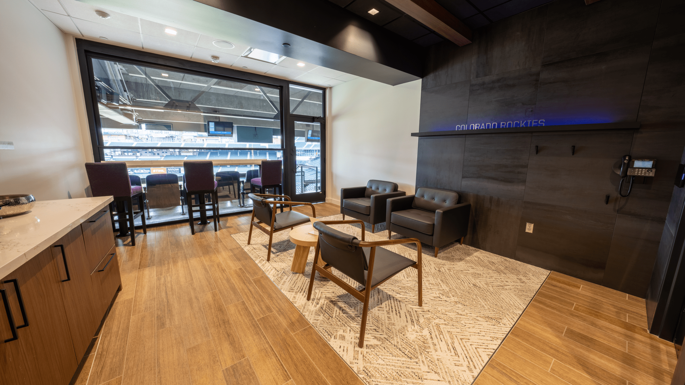 Premium home plate suite at Coors Field offering Colorado Rockies luxury seating and stadium views.