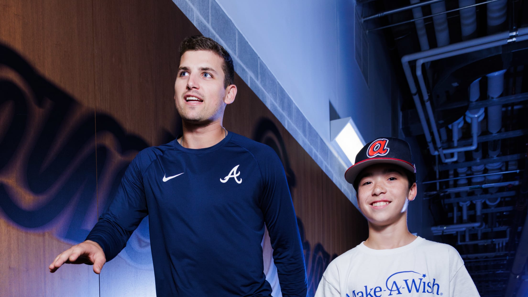 Austin Riley walks with a Make-A-Wish participant at Truist Park,