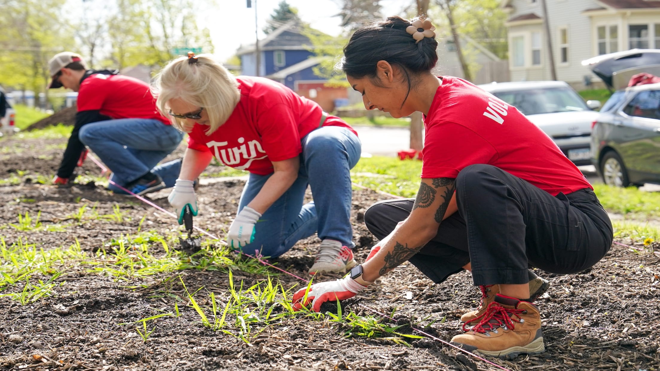 Twins employees planting a garden as part of volunteer activities