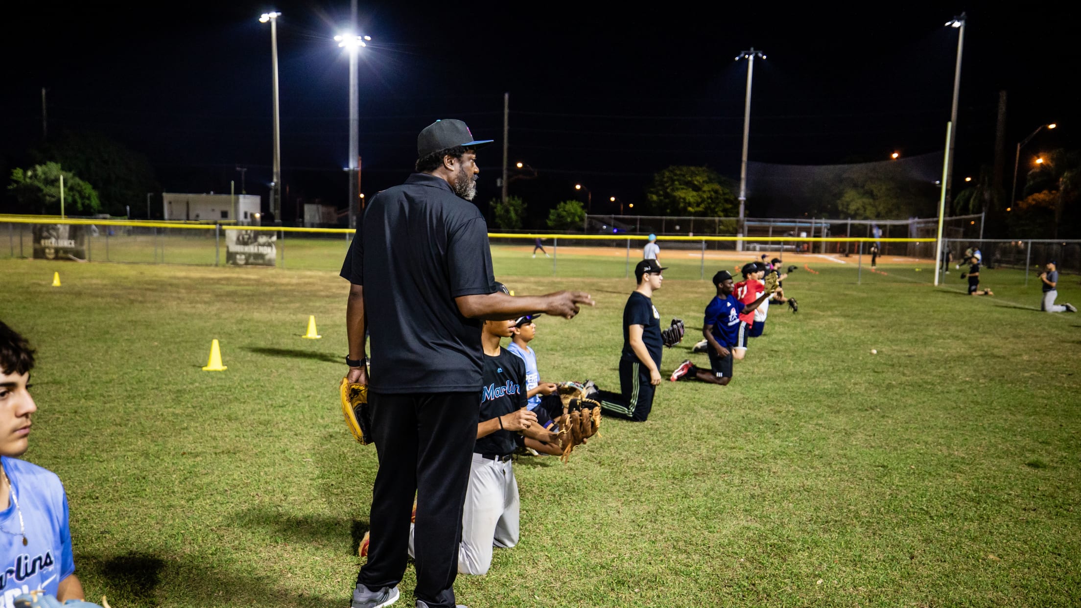 Players participate in a throwing drill at the Marlins Youth Academy Nike RBI Winter Development Clinic.