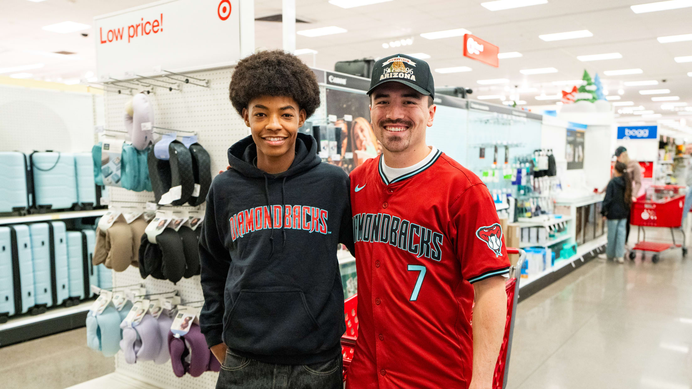 Corbin Carroll takes a picture with a teen at Target as the Diamondbacks partner with A New Leaf to gift 40 teenagers a $250 shopping spree.