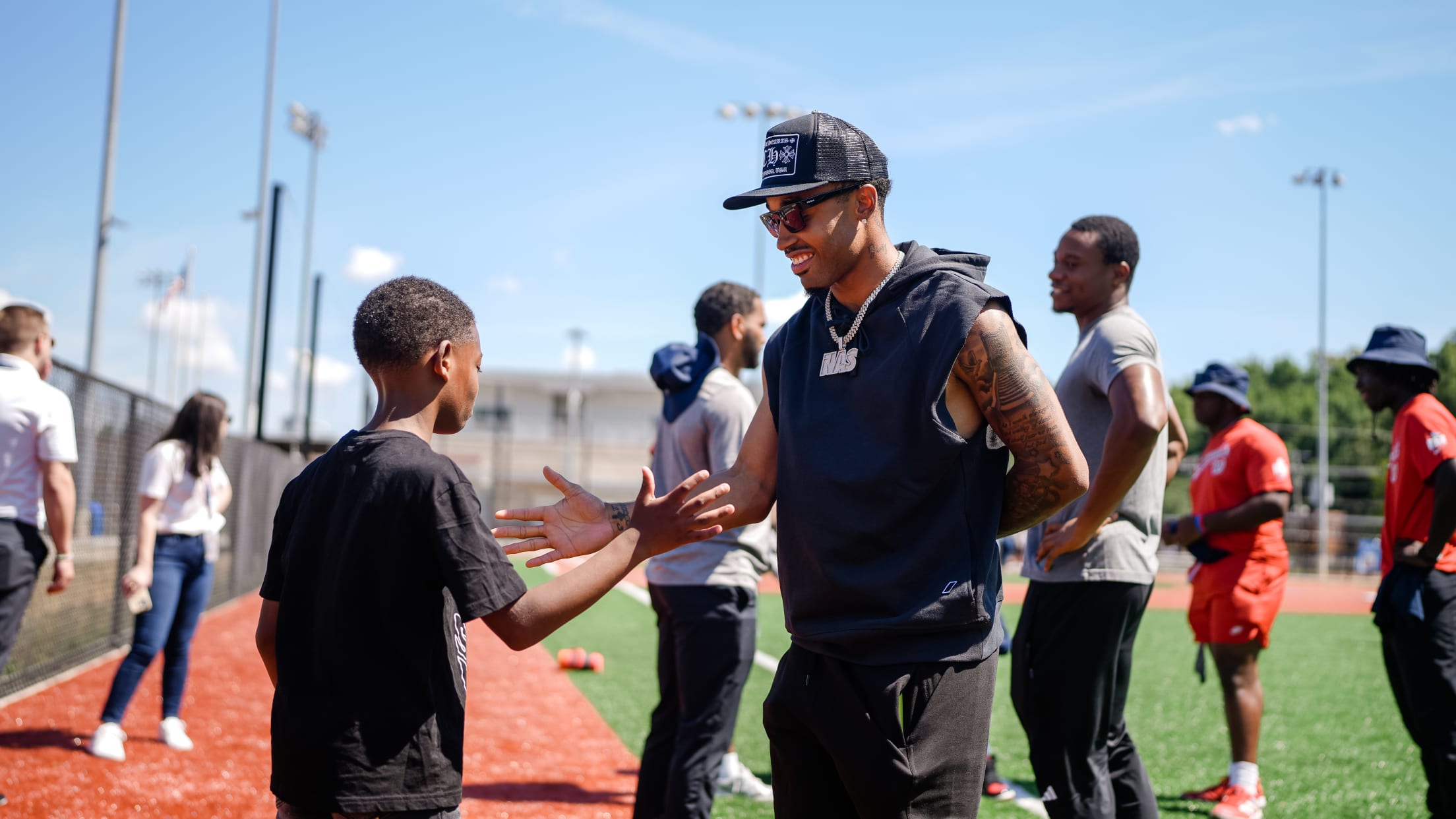 Nasim Nuñez interacts with a young player at the Nationals Youth Baseball Academy.