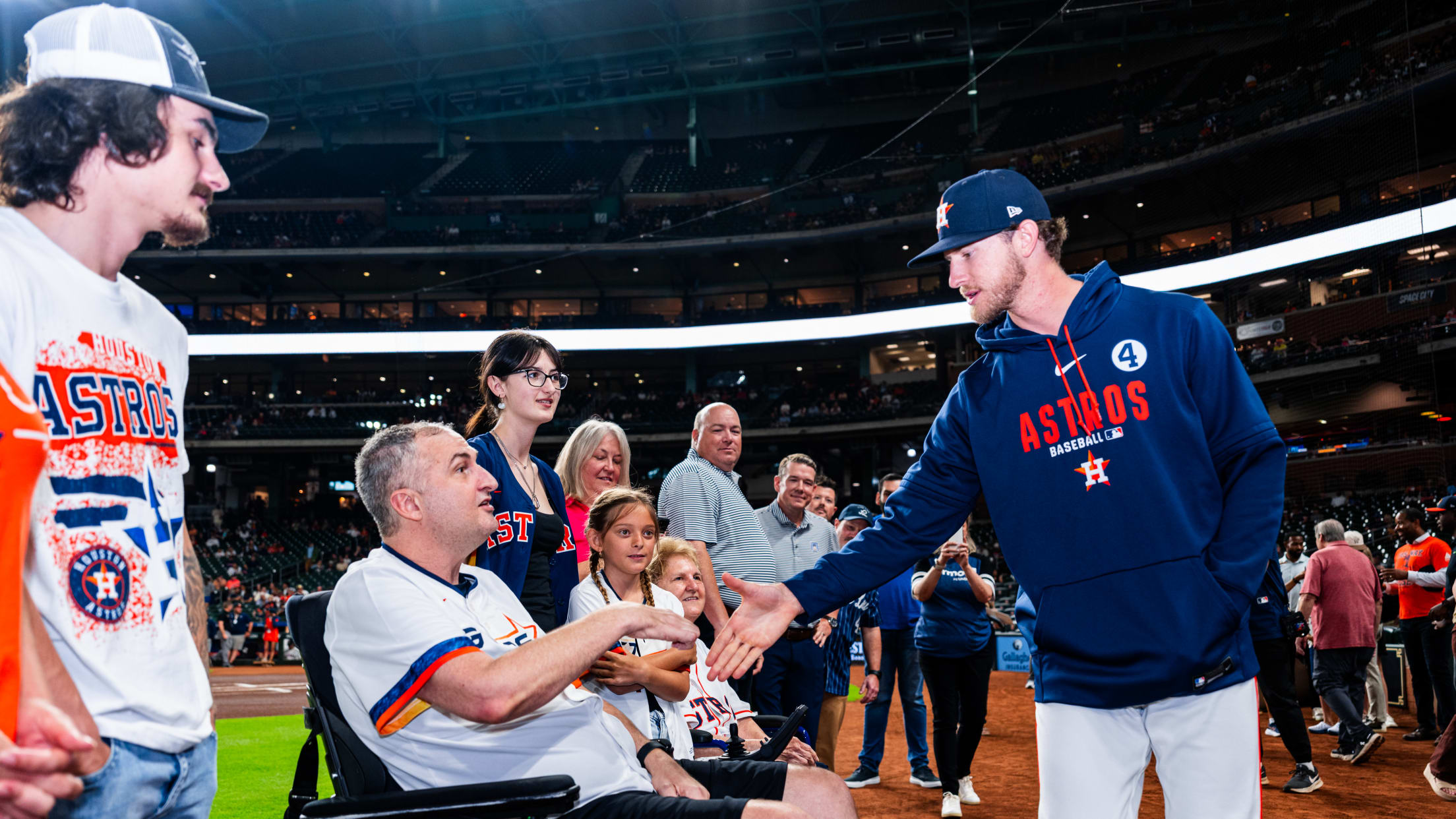 Josh Hader shakes hands with fans during pregame ceremonies at Daikin Park.