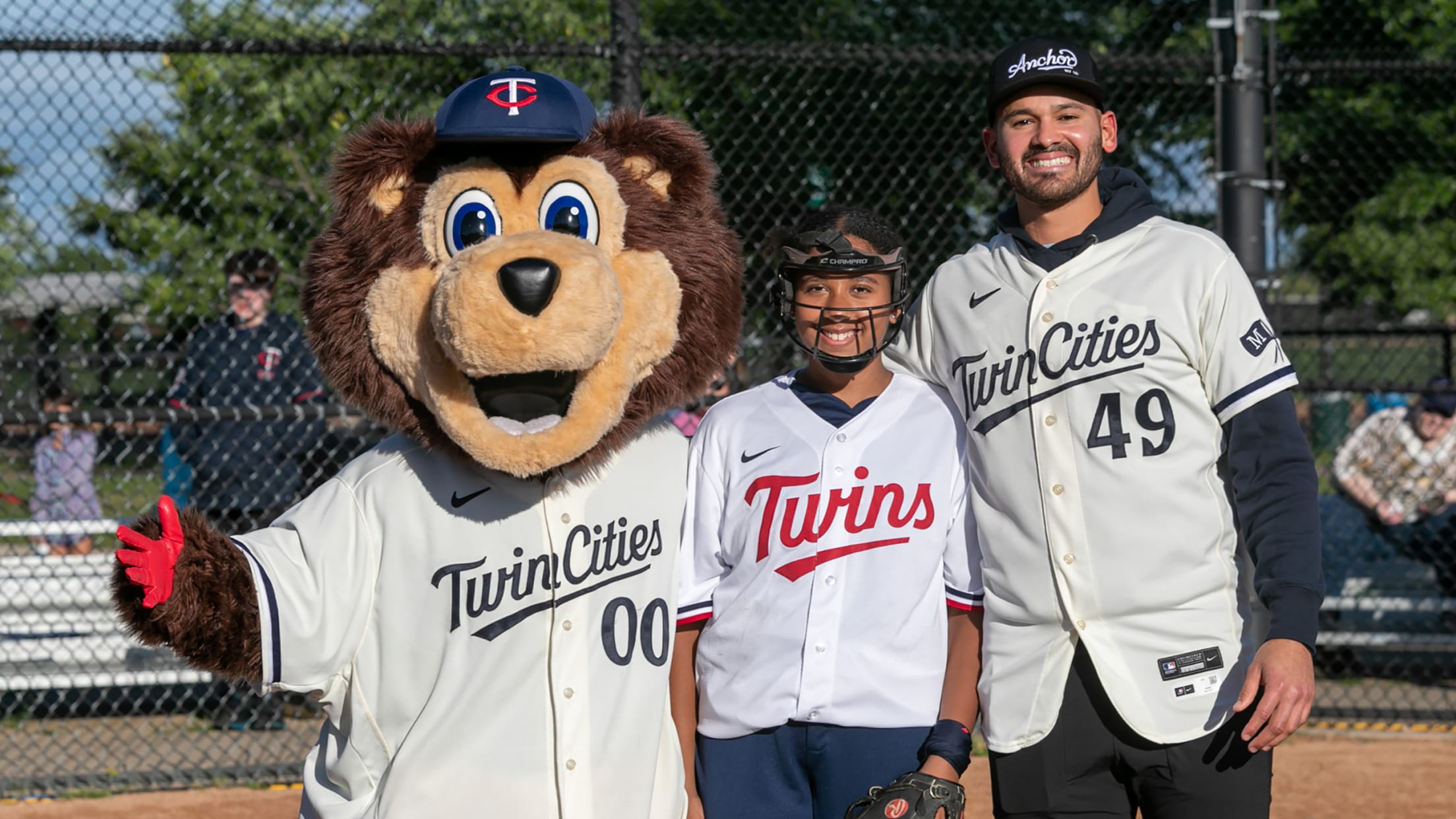 Pablo López with a youth softball player and T.C. Bear at a Twins Youth Game Takeover event