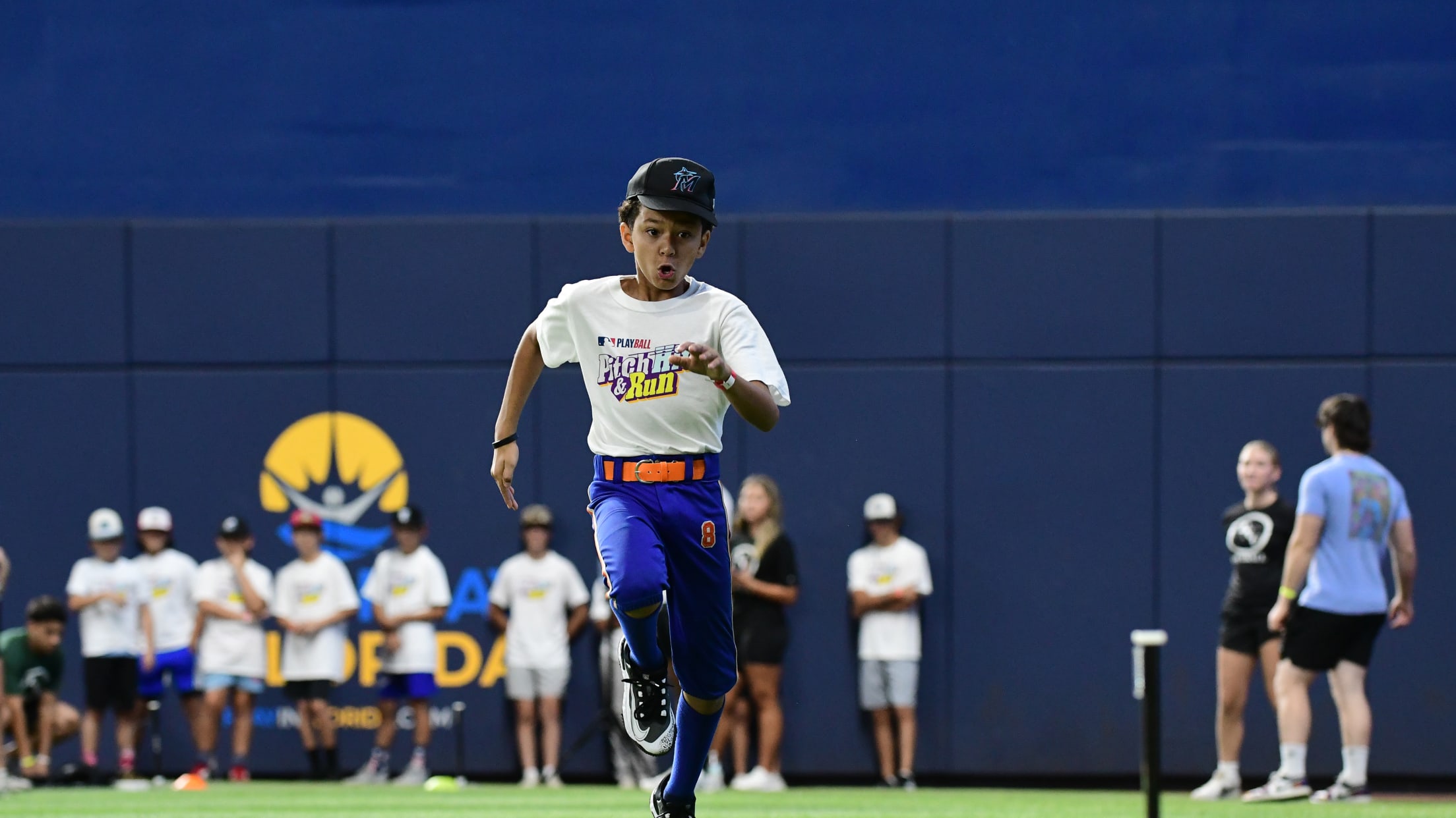 A player sprints across the field at loanDepot Park,