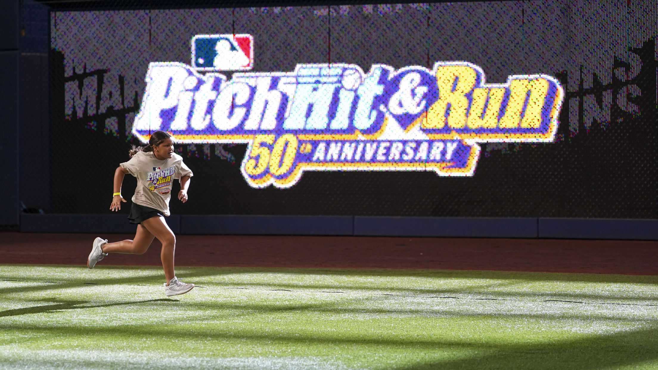 A young player runs in the outfield at MLB Pitch, Hit & Run.