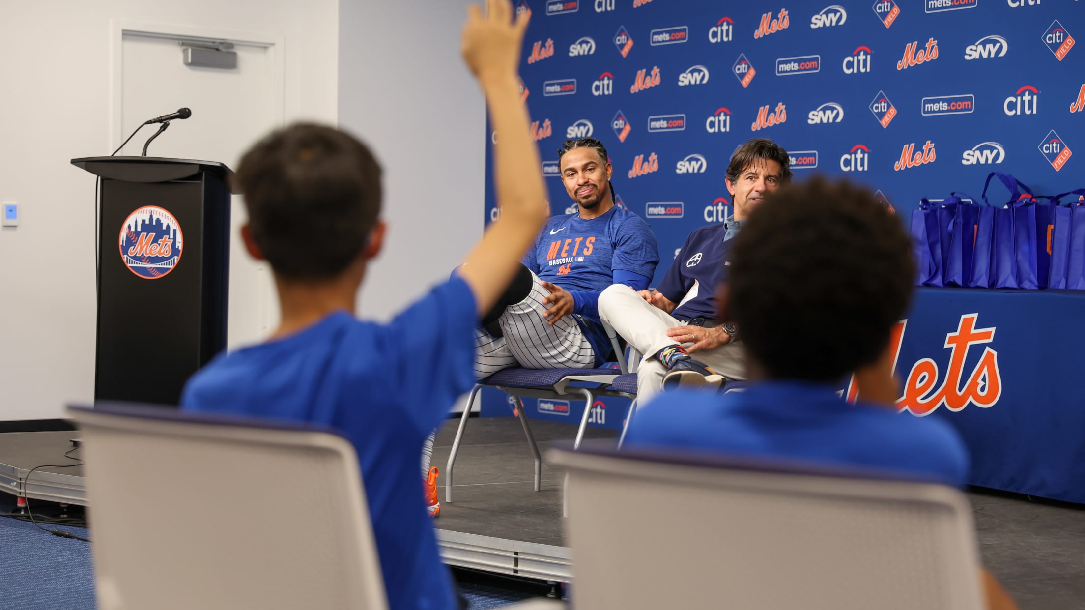 Francisco Lindor takes a question from a kid at a conference.