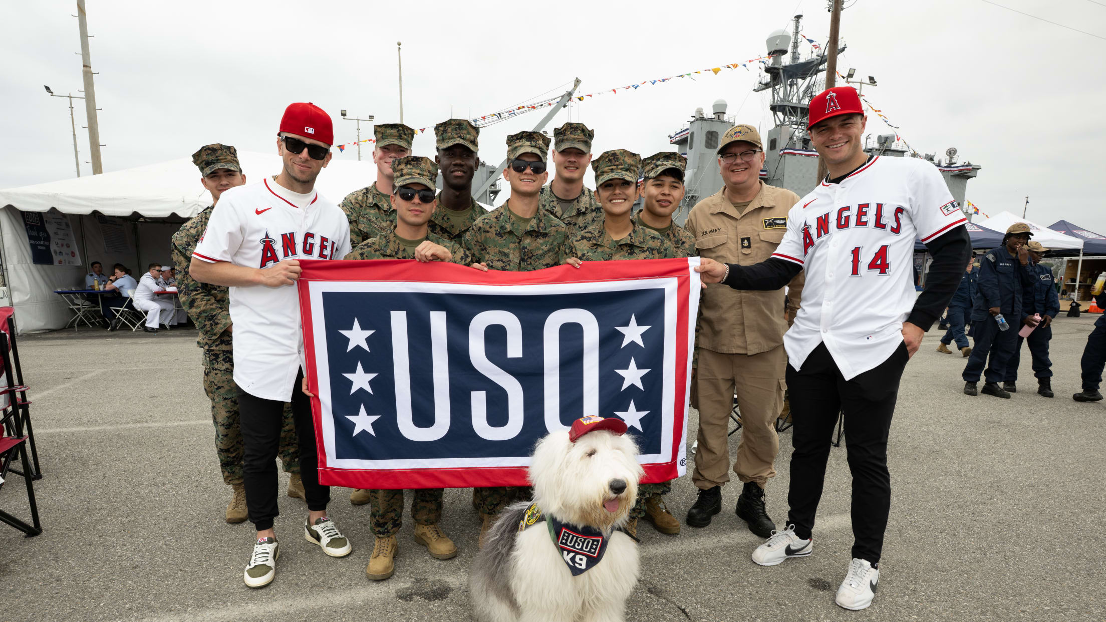 Zach Neto takes a photo with United States service members.