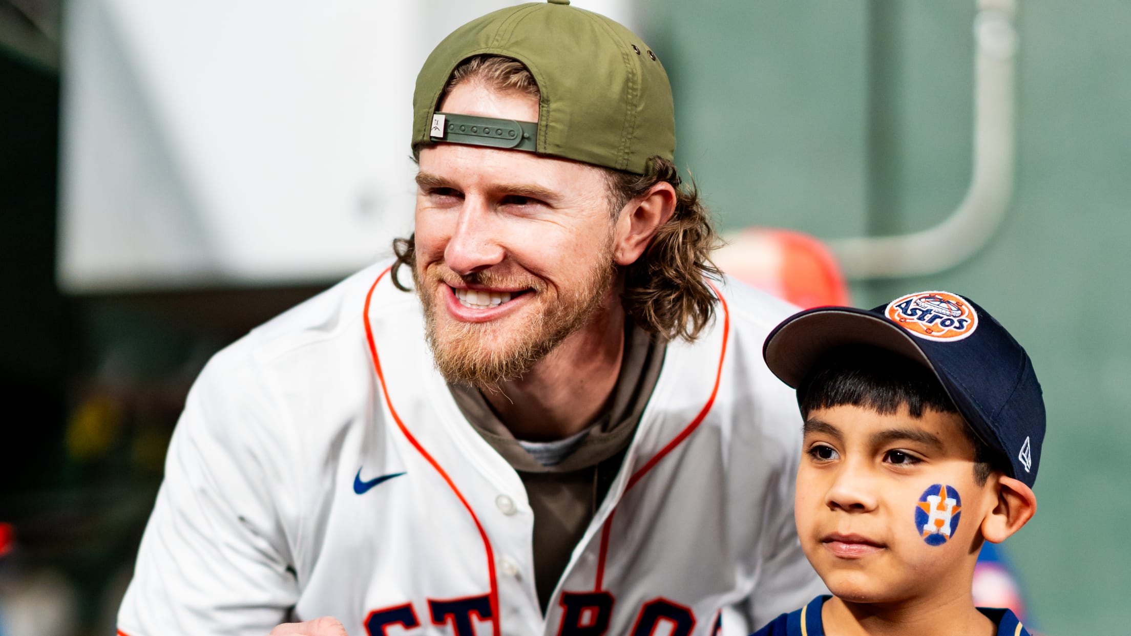 Josh Hader takes a photo with a Houston Astros fan.