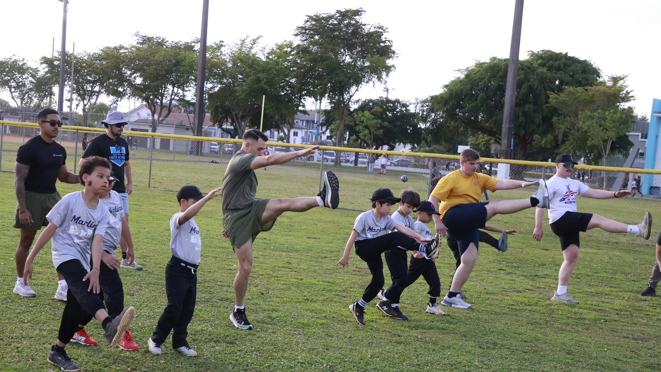 Players and coaches go through stretching drills.