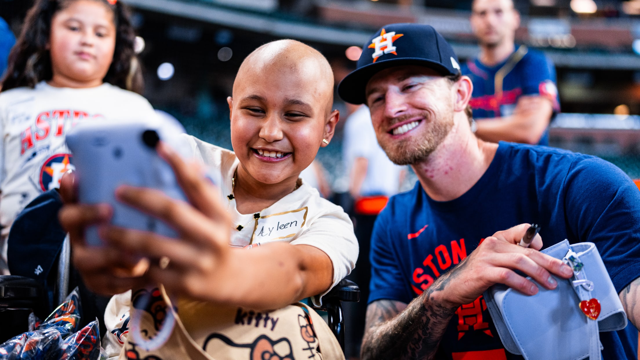 Josh Hader is all smiles with a Houston Astros fan as they take a selfie.