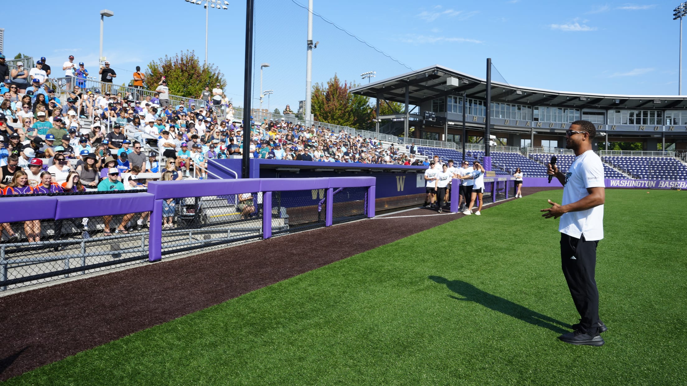 Julio Rodriguez speaks to a baseball and softball at the No Limits Youth Baseball and Softball Camp at the University of Washington.