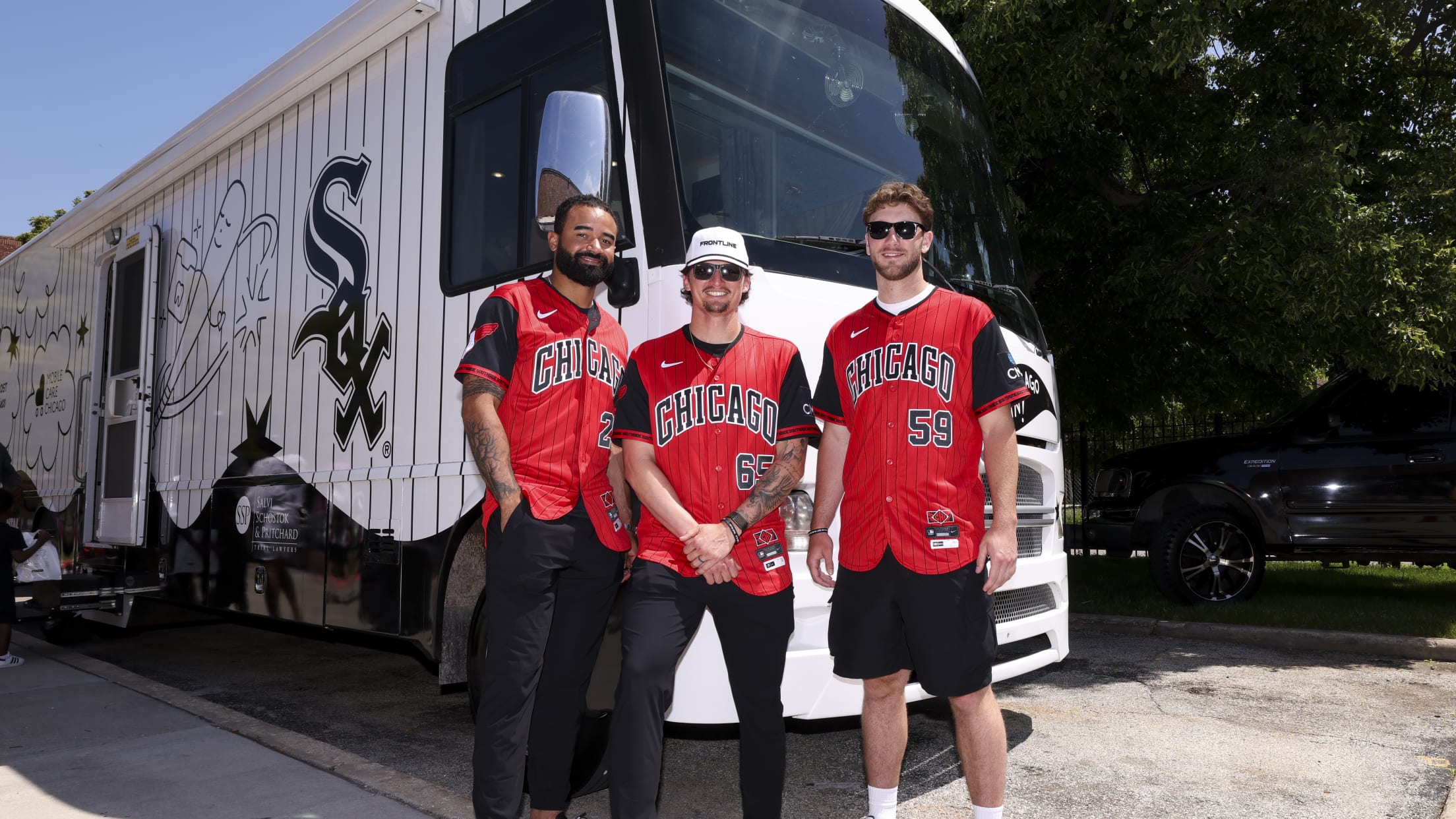 Davis Martin is joined by teammates at a mobile care dental clinic in Chicago.