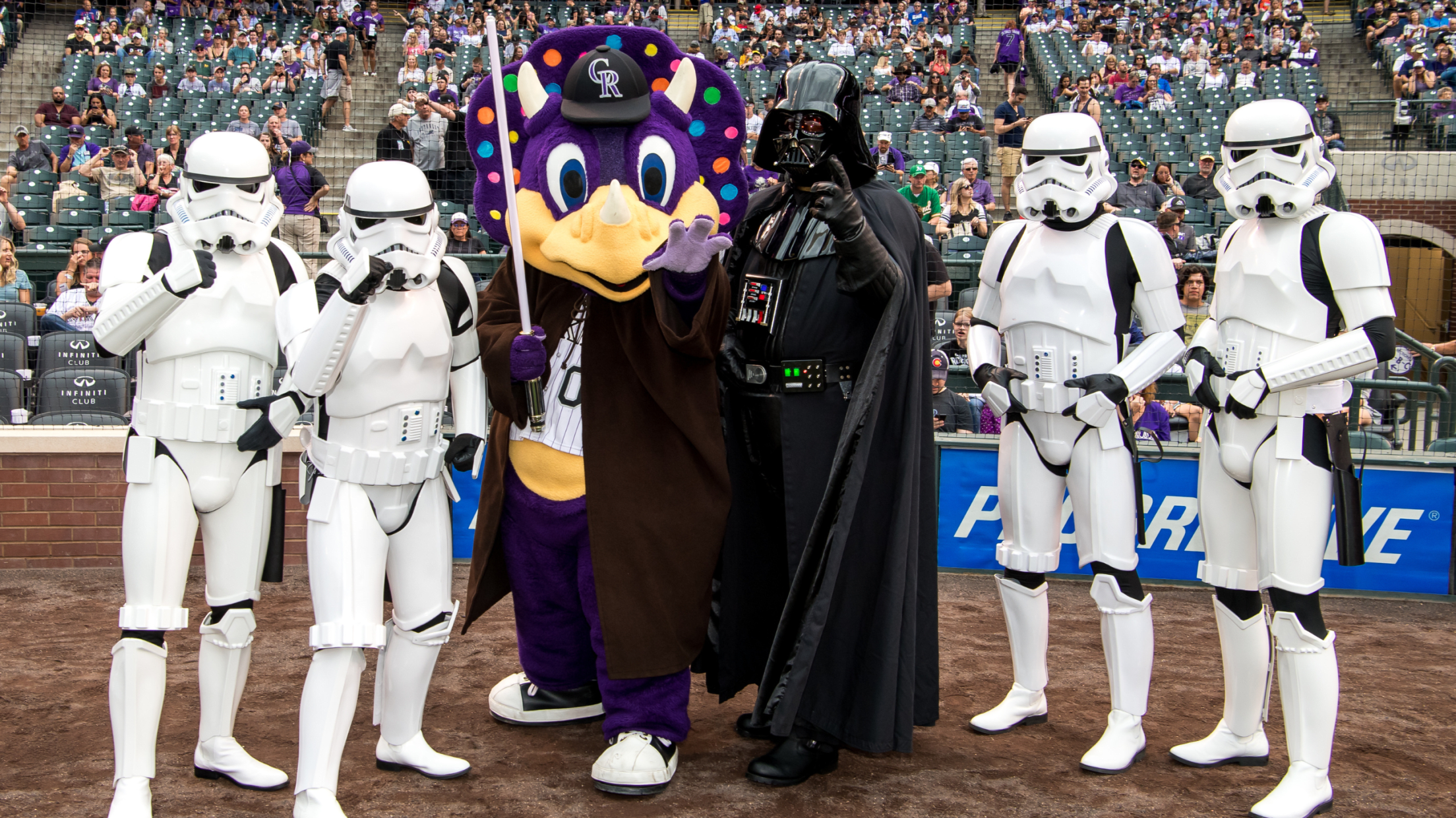 Dinger the mascot and stormtroopers behind home plate