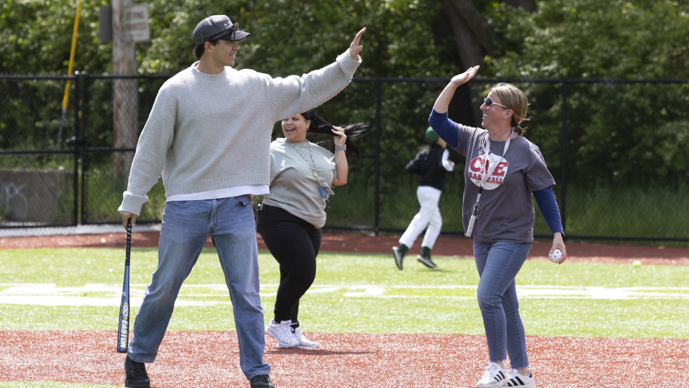 Joey Cantillo high fives a coach.