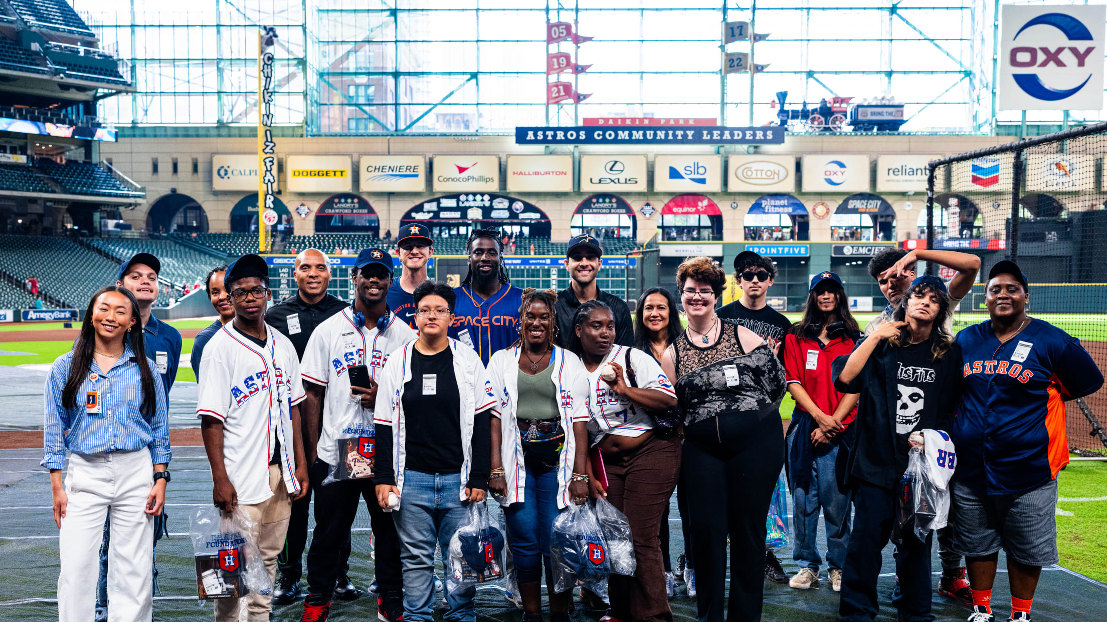 Fans take the field at Daikin Park for a photo before the Houston Astros take on the Miami Marlins.