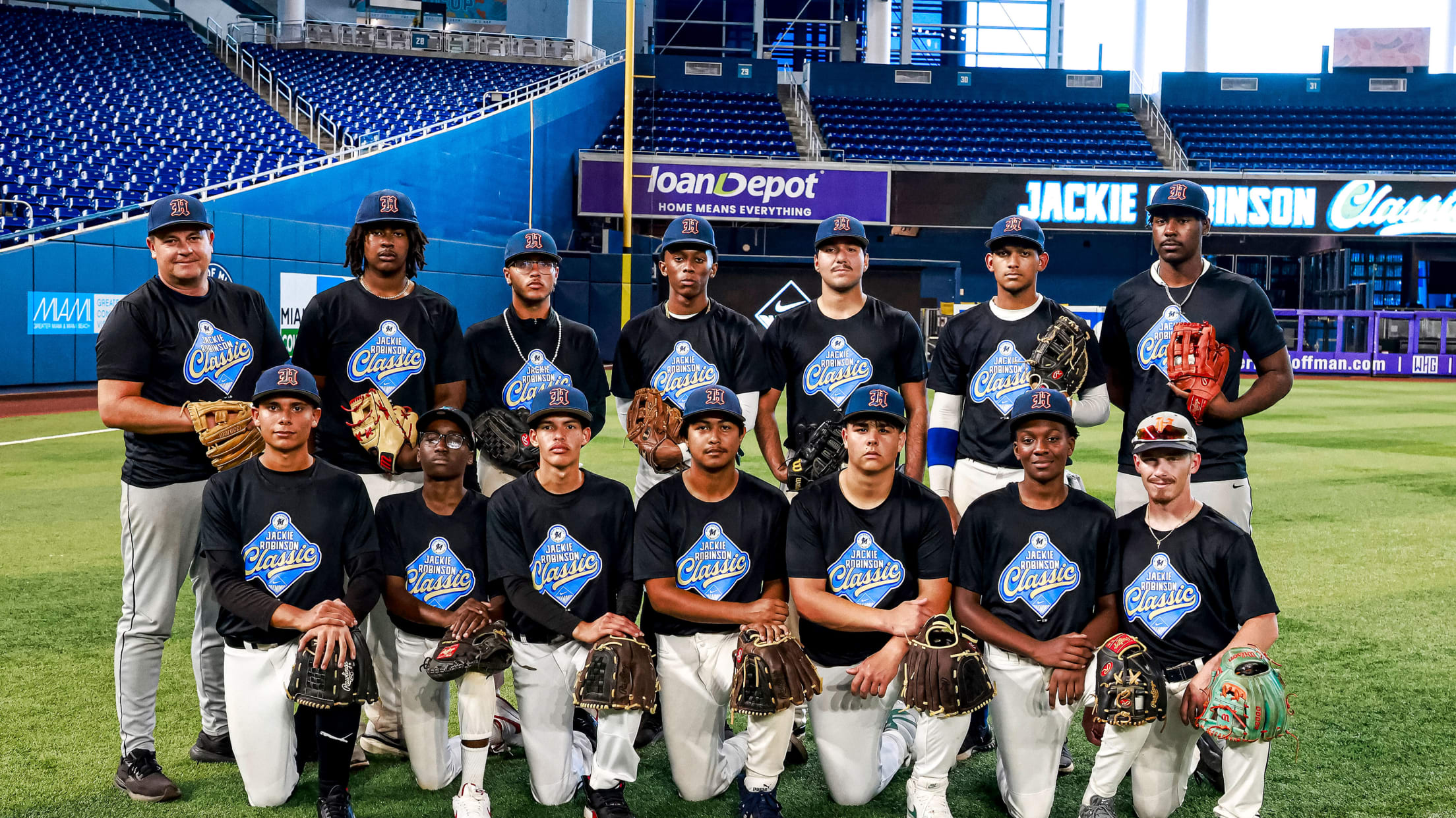 Miami Youth Academy athletes pose for a photo at the Jackie Robinson Classic.