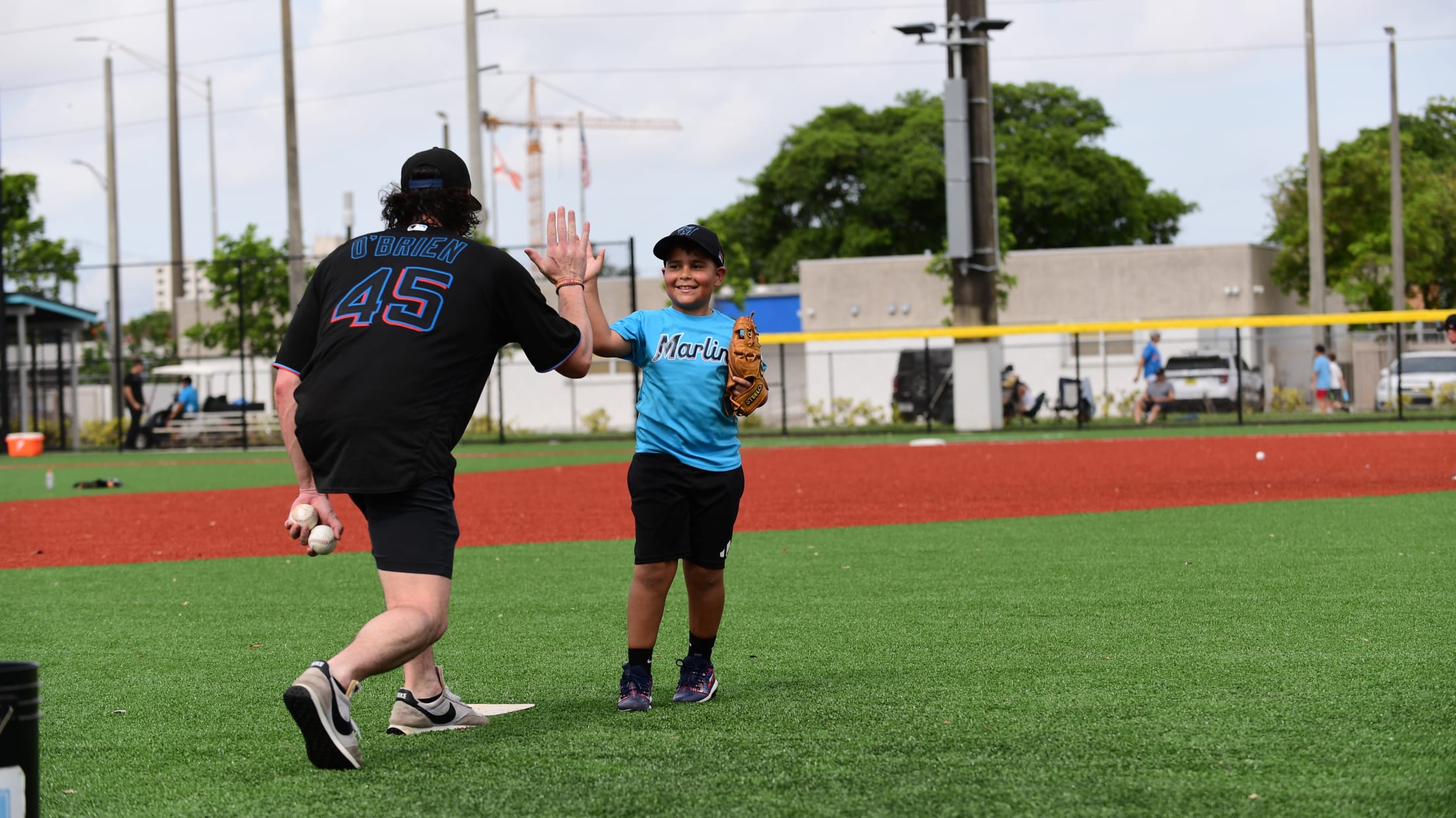 A coach high-fives his player.