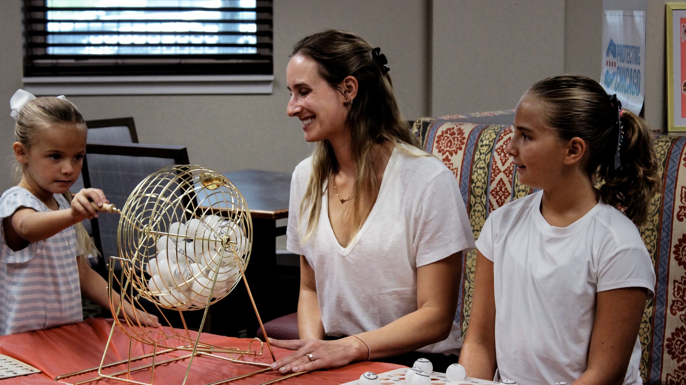 Davis Martin's wife, Jenna Martin, joins in on the bingo fun at the Senior Suites event.