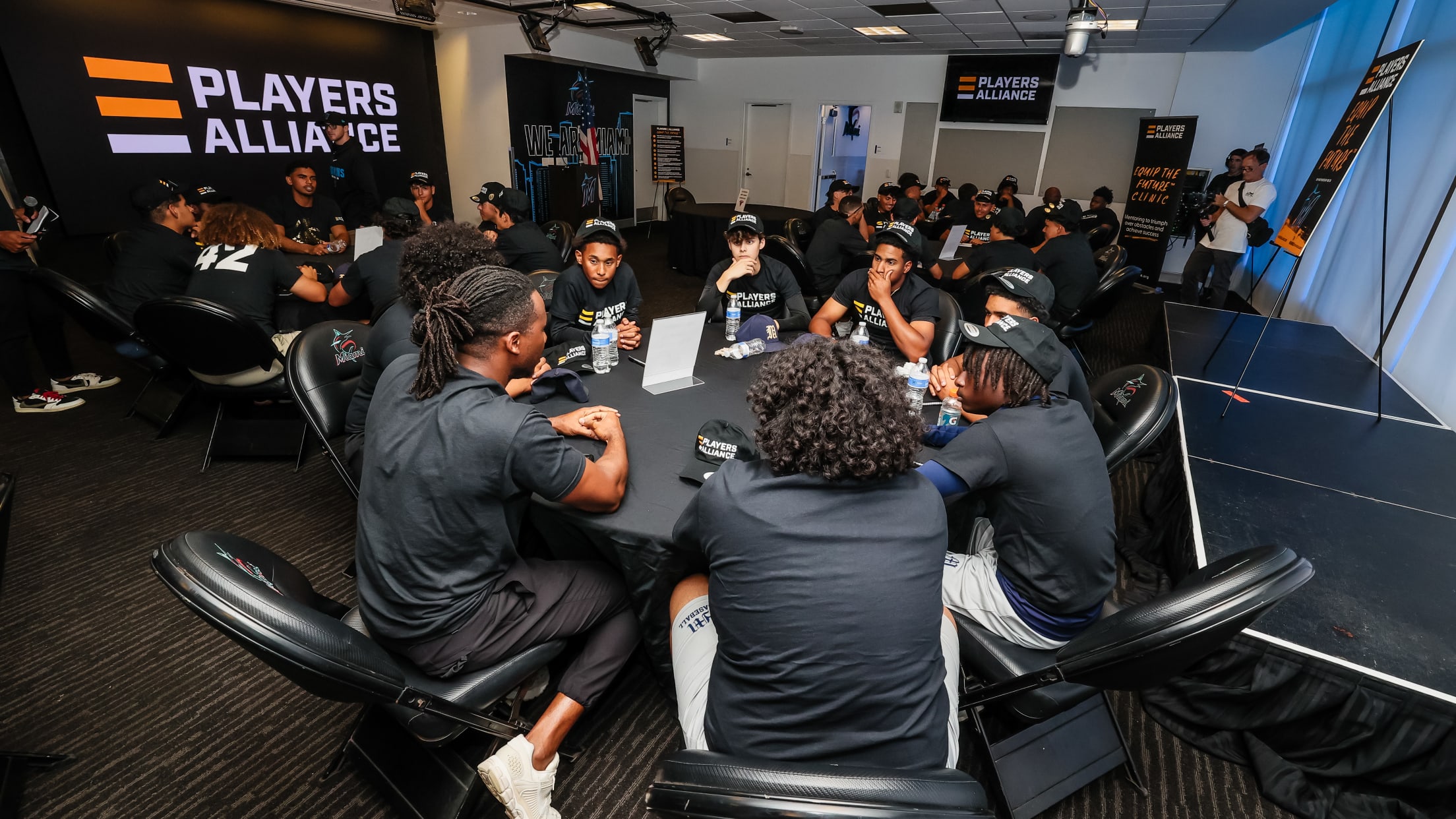 Players sit and talk at The Players Alliance Equip the Future Clinic.