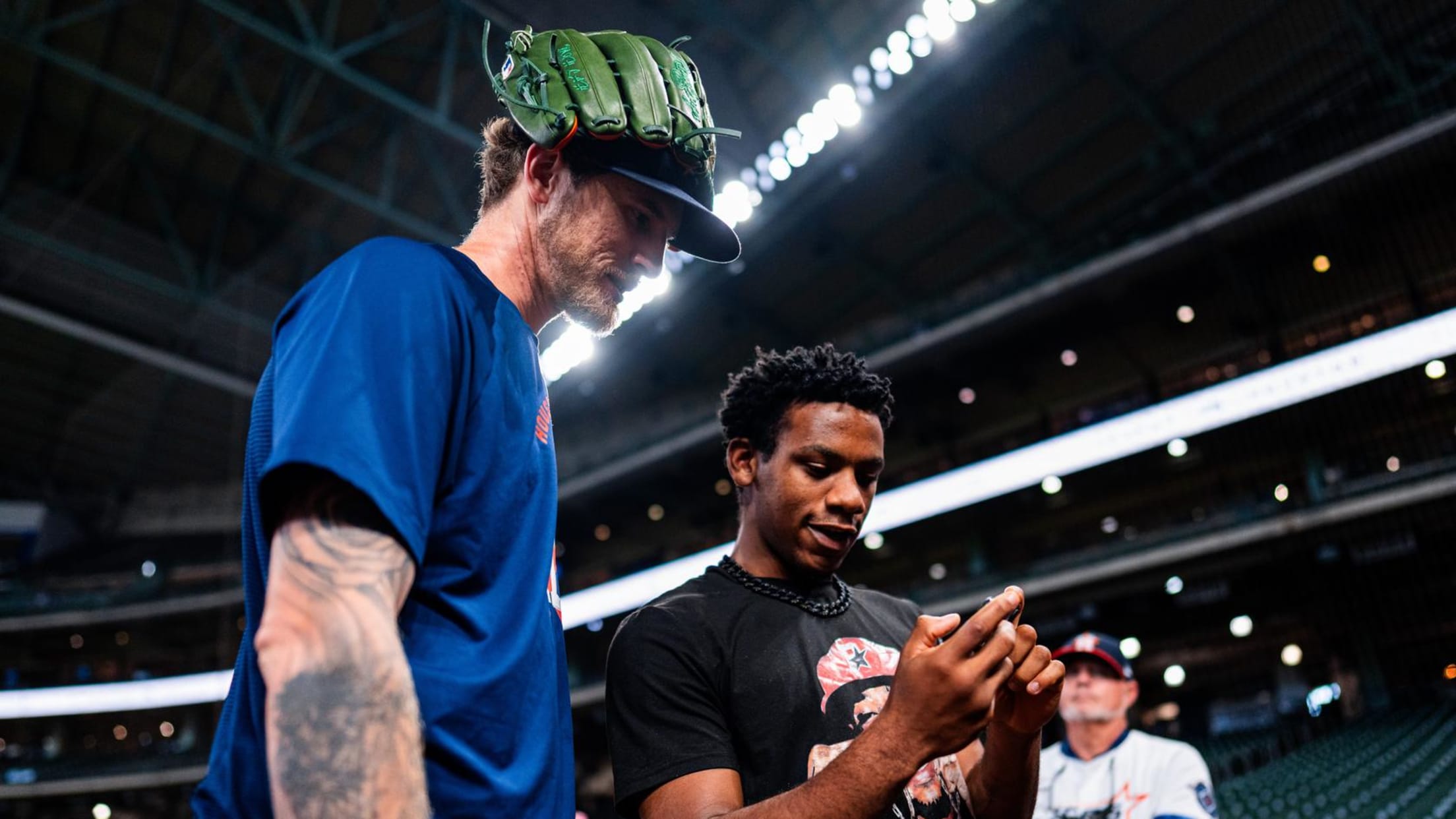 Josh Hader interacts with a fan during pregame practice.