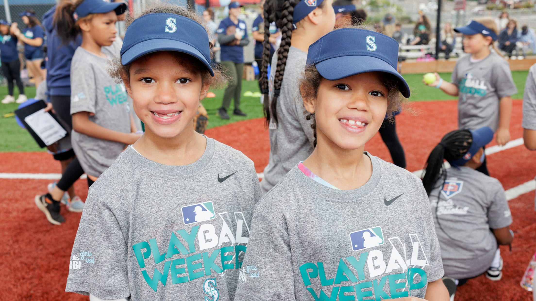 Image of two young children at PLAY BALL Weekend.
