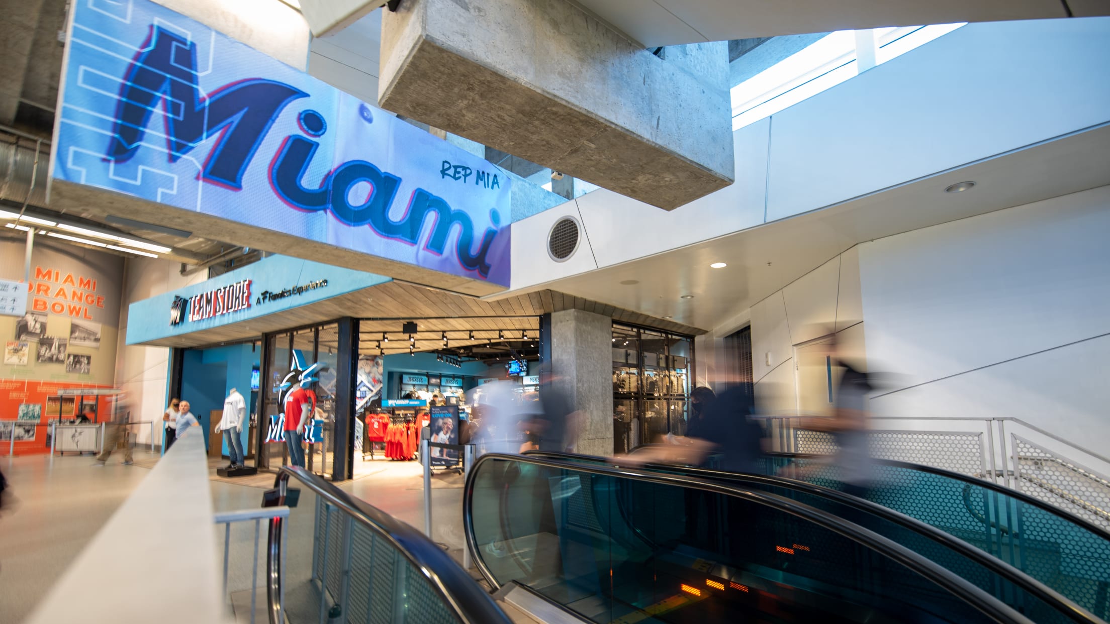 Fans taking the escalator inside loanDepot park