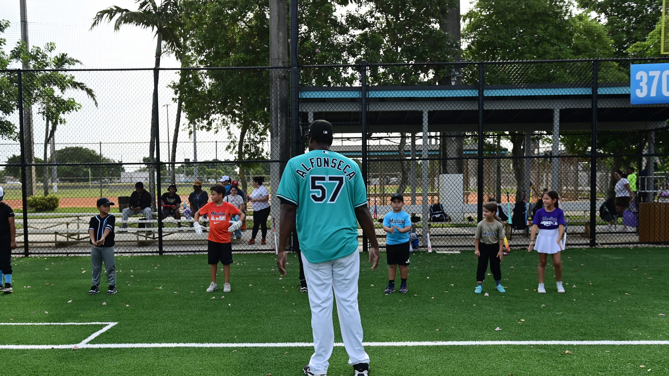 Former Florida Marlins relief pitcher Antonio Alfonseca speaks to young players.
